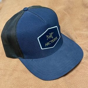 Blue and green arcteryx hat